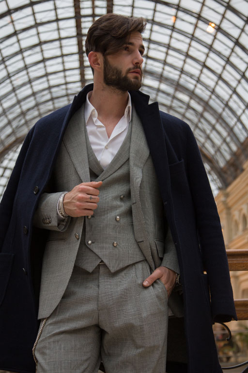 A dashing young man is standing under a magnificent dome waiting for ...